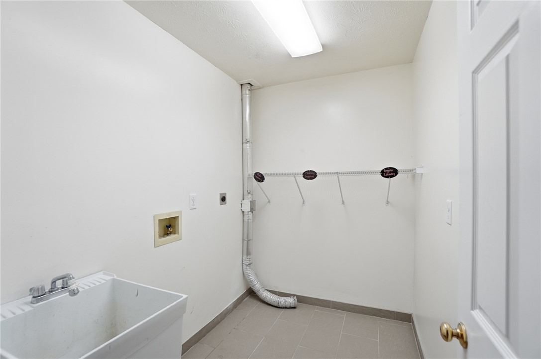 10 Chase Court Springboro, OH 45066 - Photo 54 of 75 Functional utility room with ample storage and a convenient wash sink.