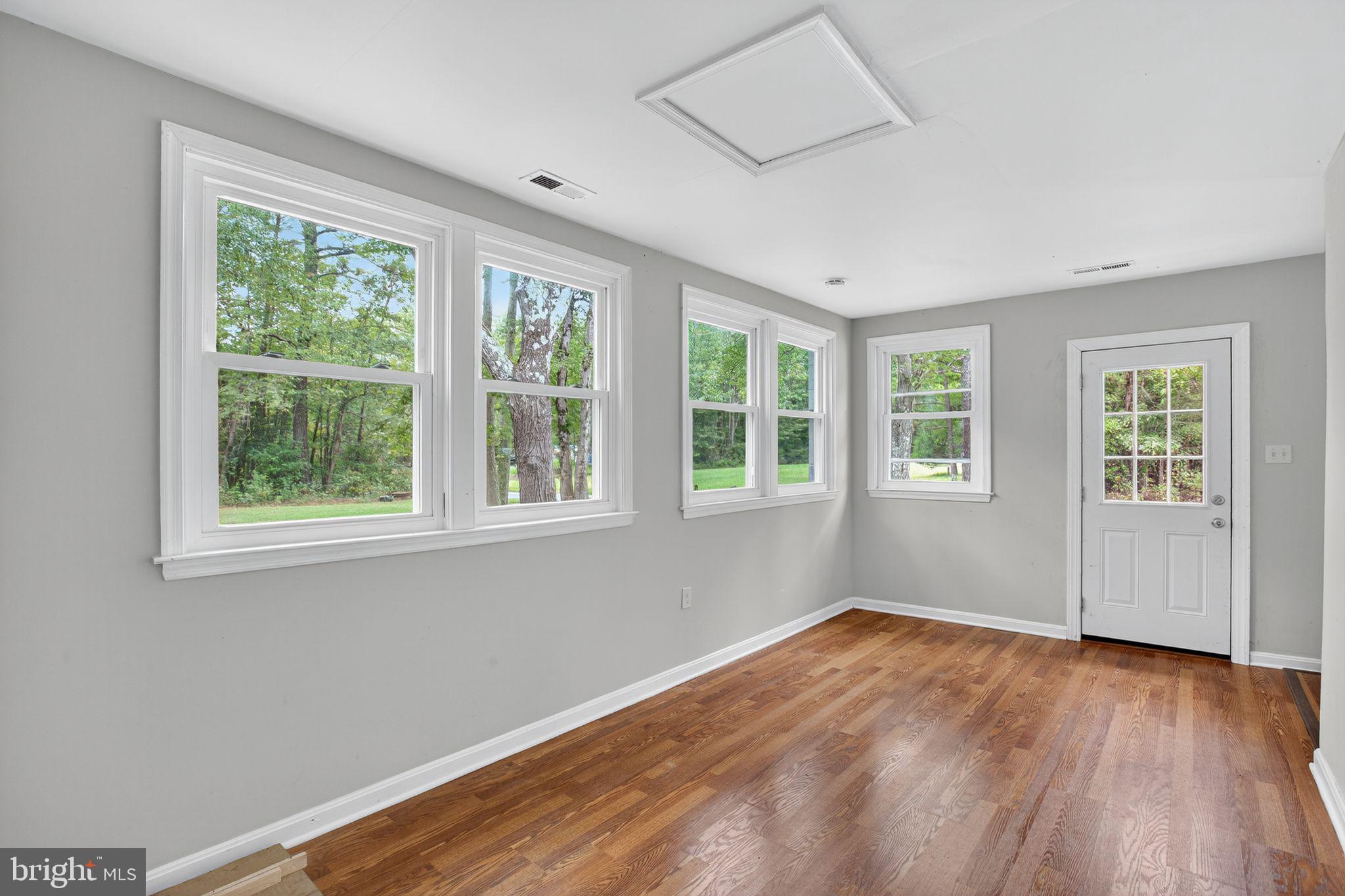 2895 Pomona Road Colonial Beach, VA 22443 - Photo 10 of 29 a view of empty room with wooden floor and fan