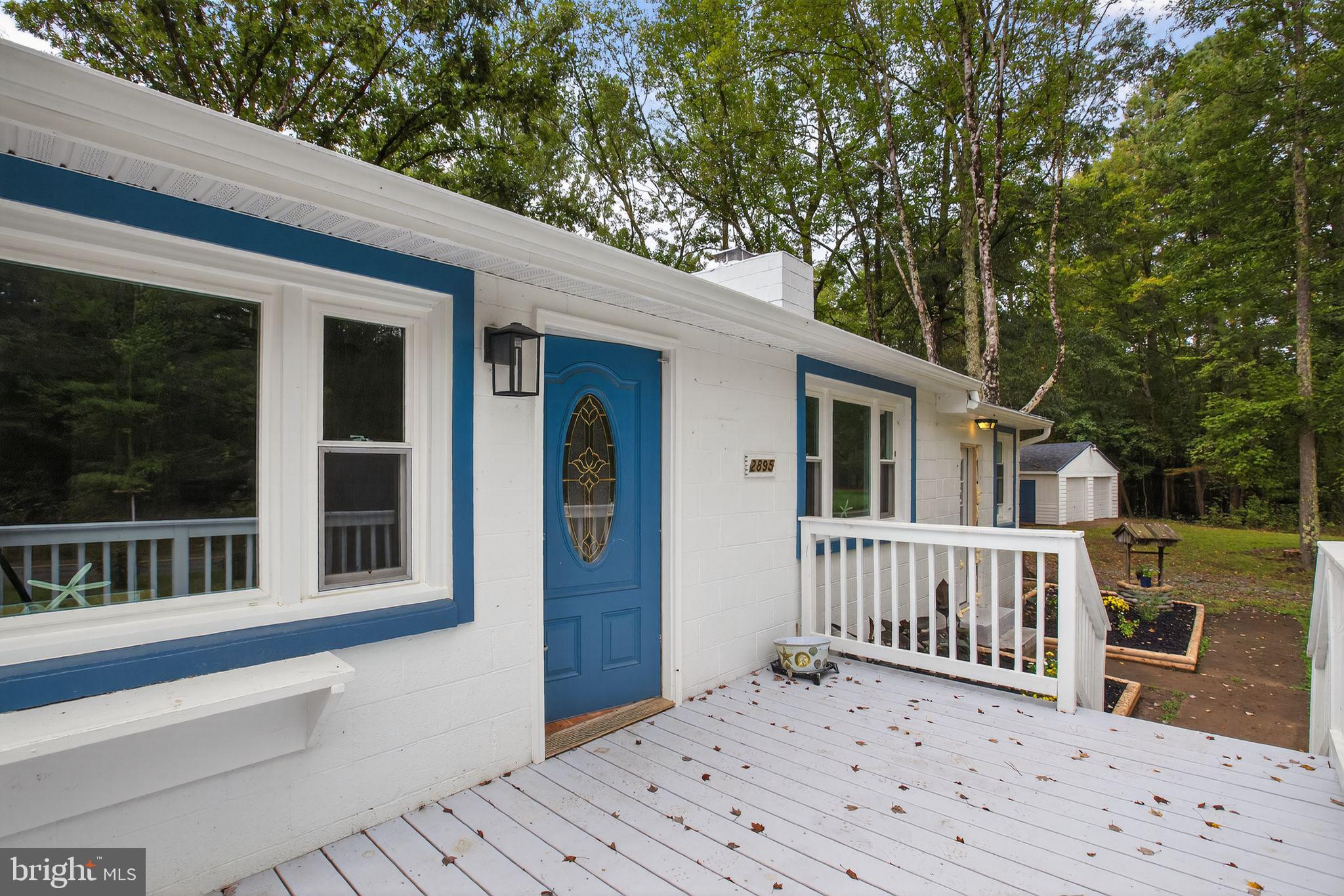 2895 Pomona Road Colonial Beach, VA 22443 - Photo 21 of 29 a view of a house with a deck