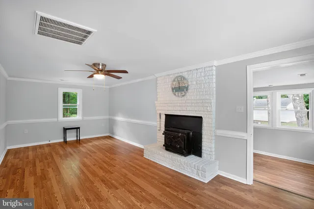 a bedroom with a bed and a fireplace