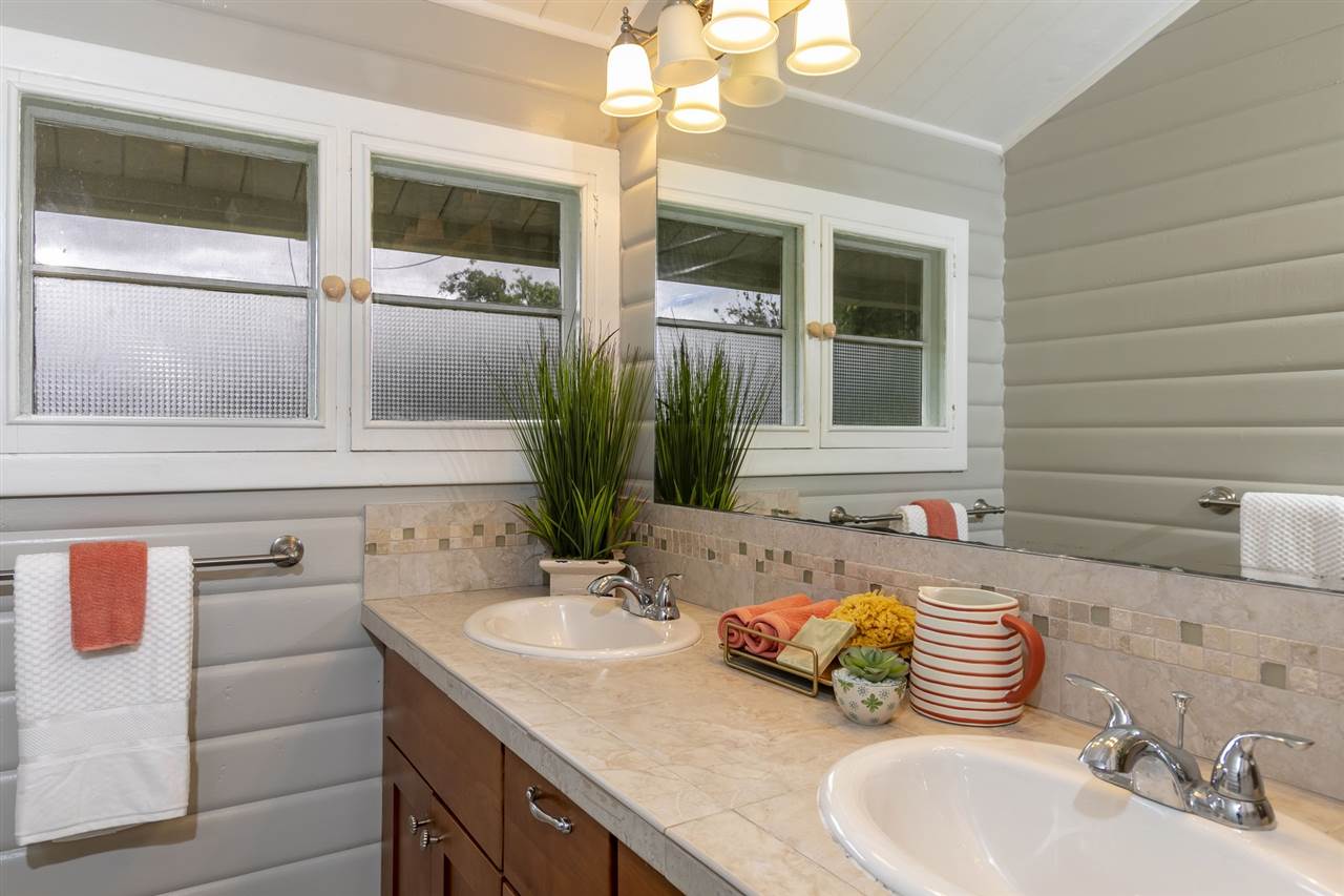 114 Alae Road Kula, HI 96790 - Photo 16 of 30 a bathroom with a sink and a mirror