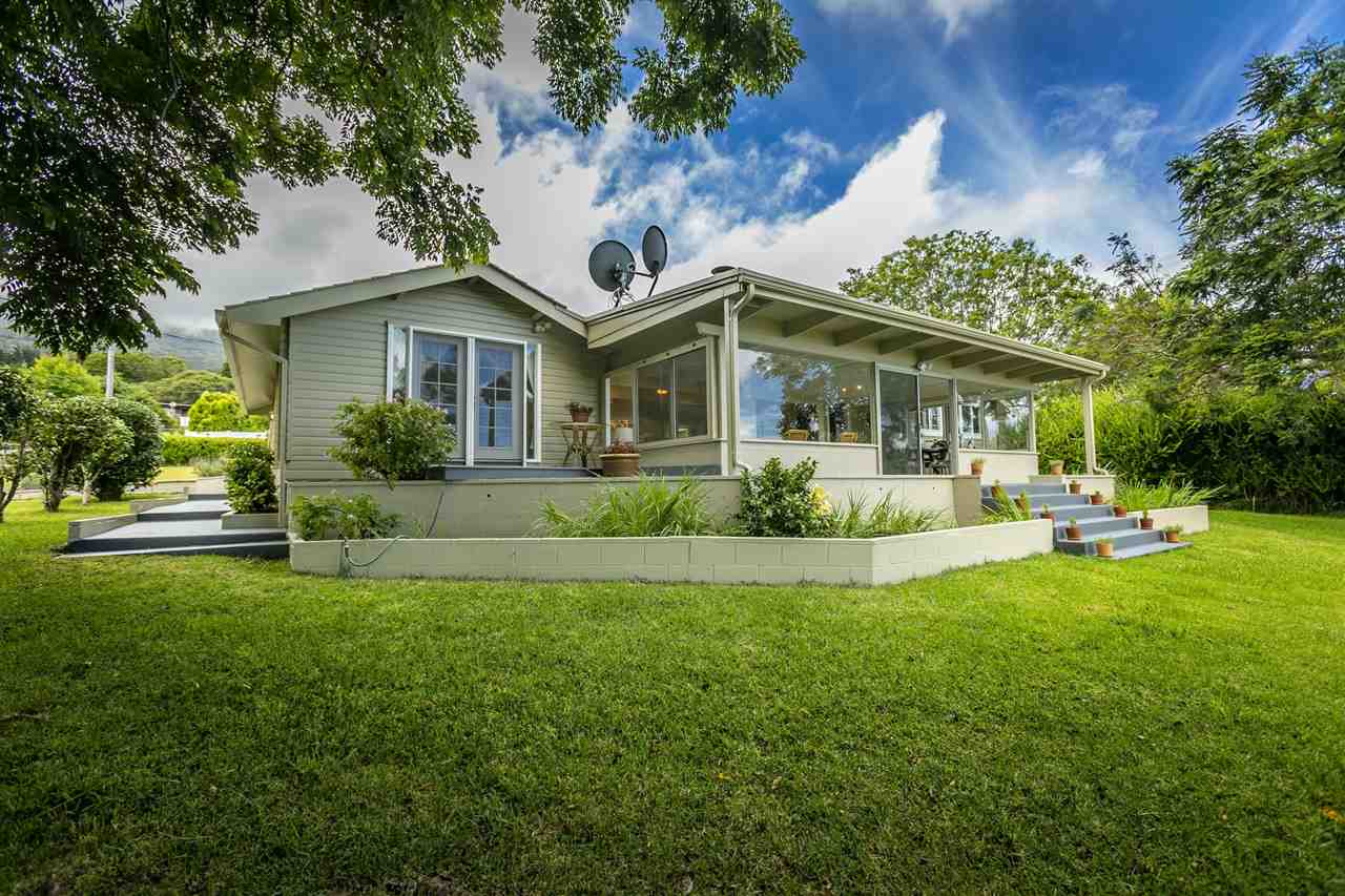 114 Alae Road Kula, HI 96790 - Photo 30 of 30 a front view of a house with a yard and potted plants