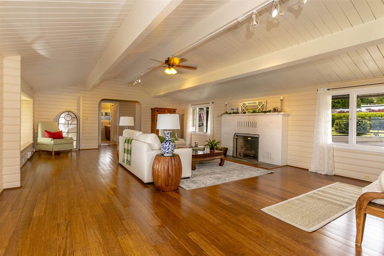 114 Alae Road Kula, HI 96790 - Photo 10 of 30 a living room with furniture and a fireplace