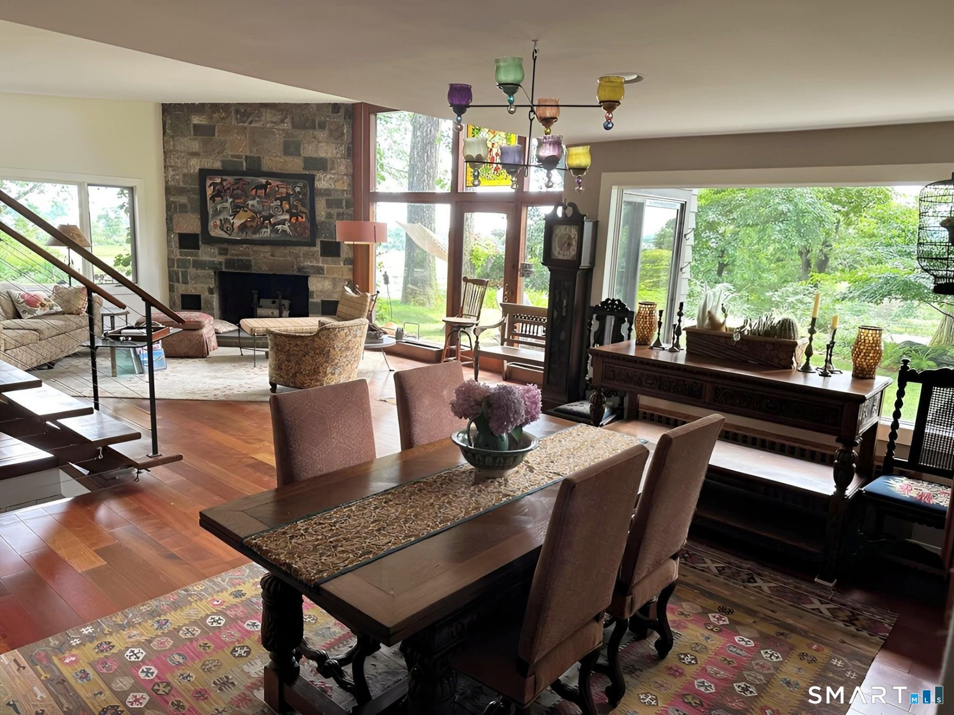 31 Splitrock Road Norwalk, CT 06854 - Photo 19 of 38 a dining room with furniture a chandelier and wooden floor