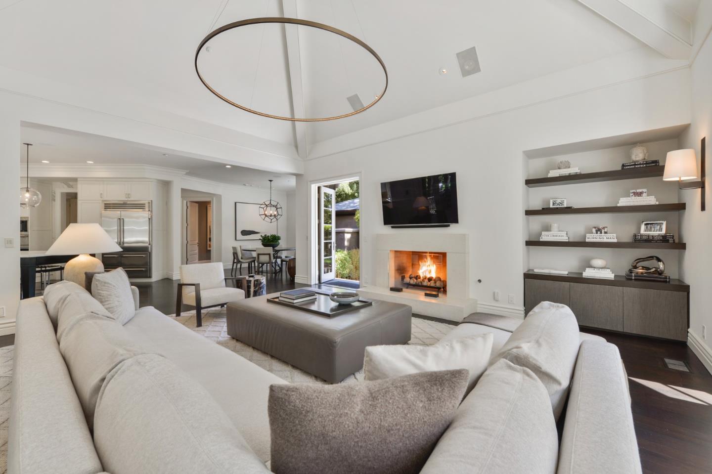 5 Faxon Forest Atherton, CA 94027 - Photo 14 of 46 a living room with furniture a flat screen tv and a fireplace