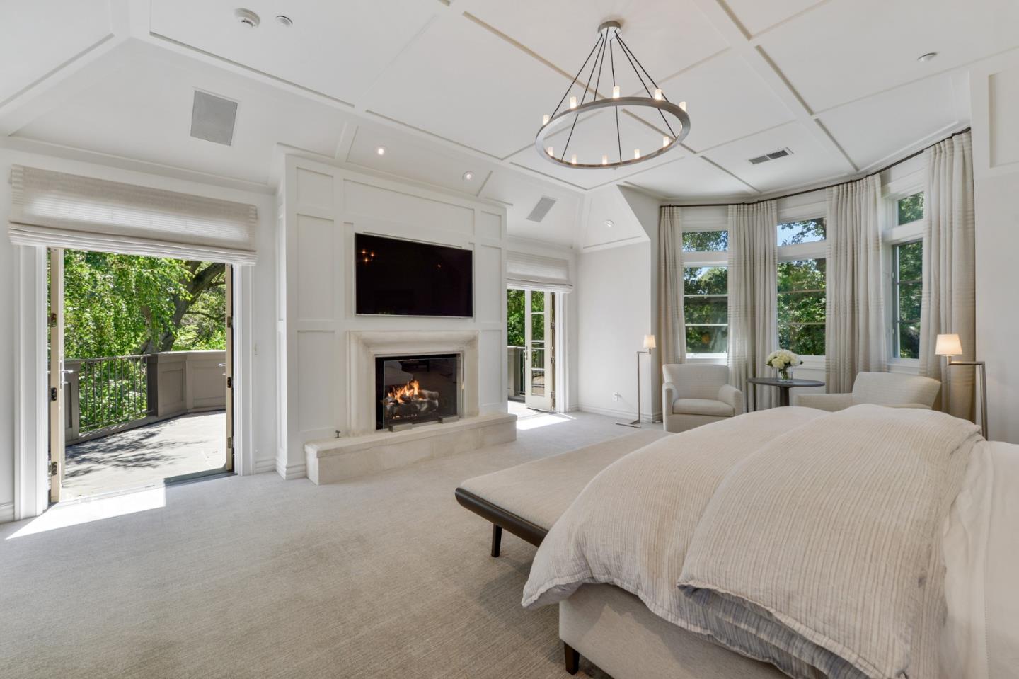 5 Faxon Forest Atherton, CA 94027 - Photo 22 of 46 a bed room with a bed and a fireplace