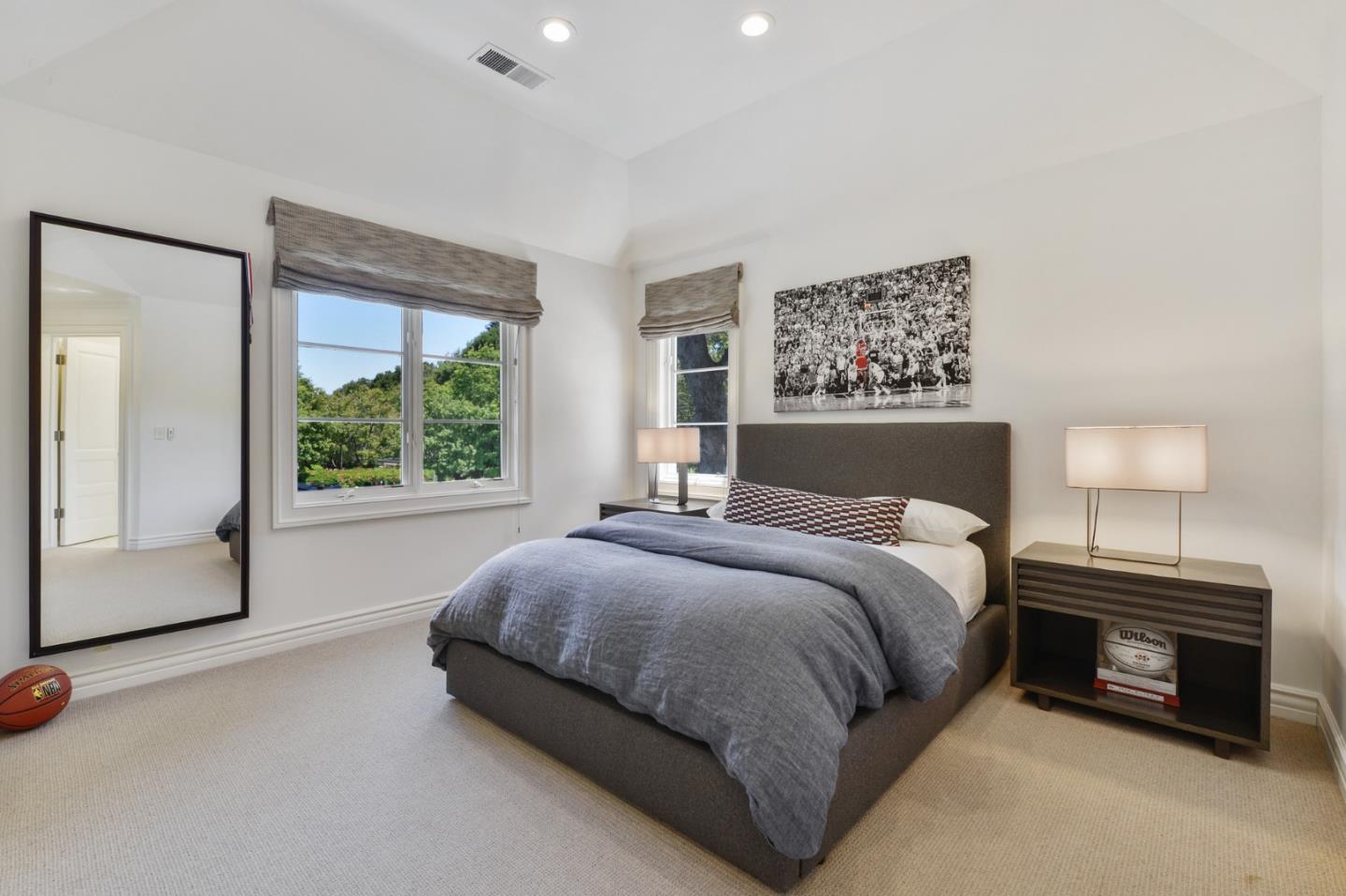 5 Faxon Forest Atherton, CA 94027 - Photo 26 of 46 a bedroom with a bed and a large window