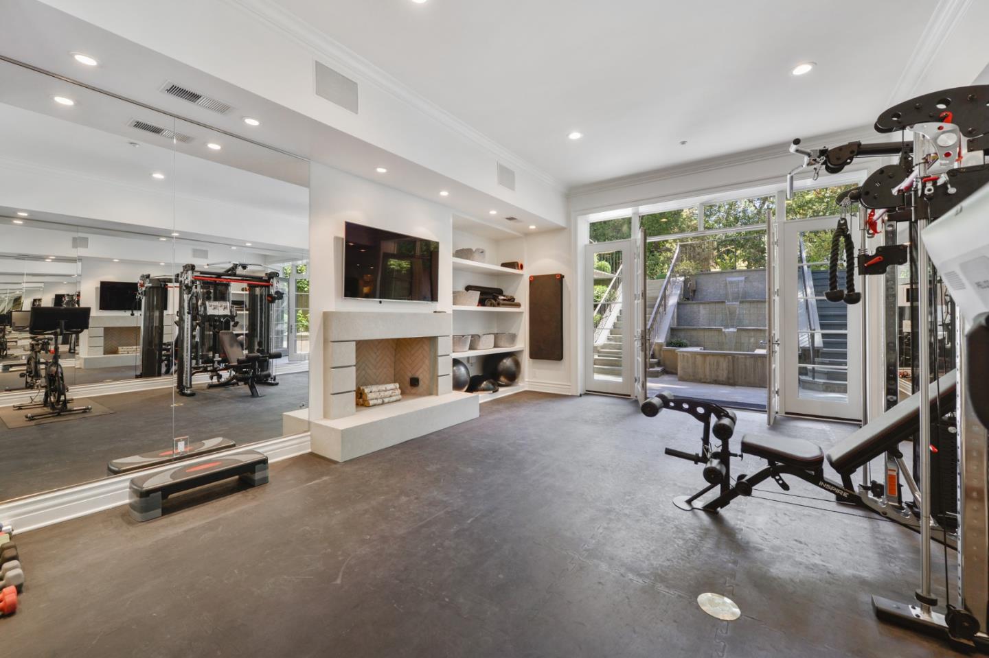 5 Faxon Forest Atherton, CA 94027 - Photo 34 of 46 a view of a room with gym equipment