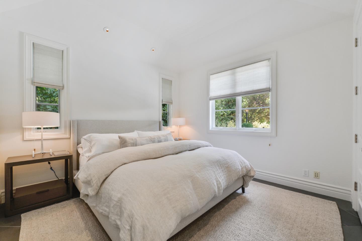 5 Faxon Forest Atherton, CA 94027 - Photo 42 of 46 a bedroom with a bed and a window