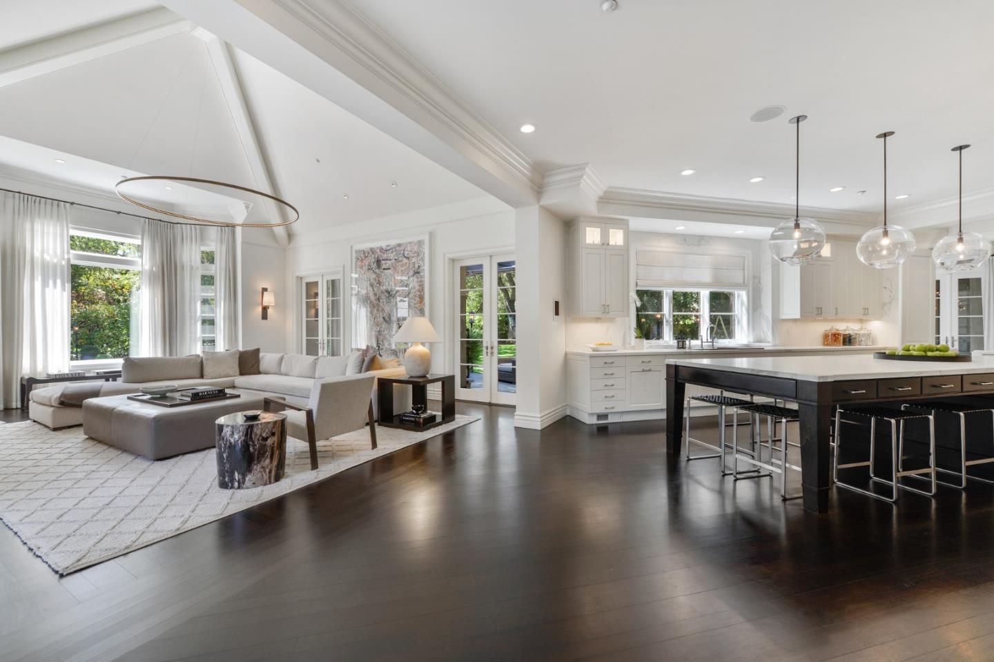 5 Faxon Forest Atherton, CA 94027 - Photo 9 of 46 a living room with couches and kitchen view with wooden floor