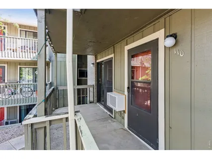 a view of an entryway with a kitchen