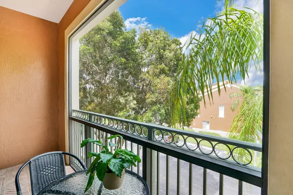 a view of balcony with furniture