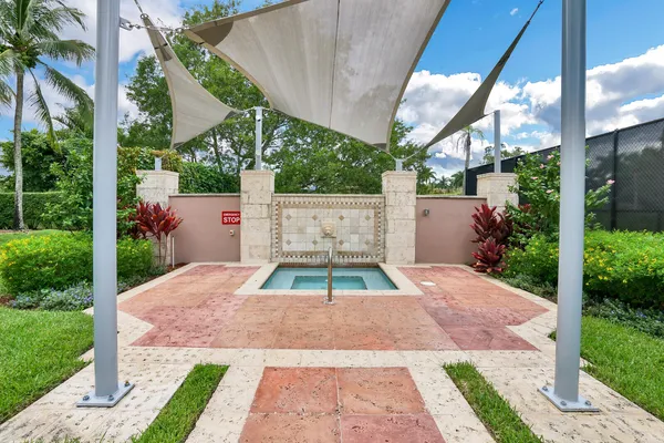 a view of backyard with a patio and plants