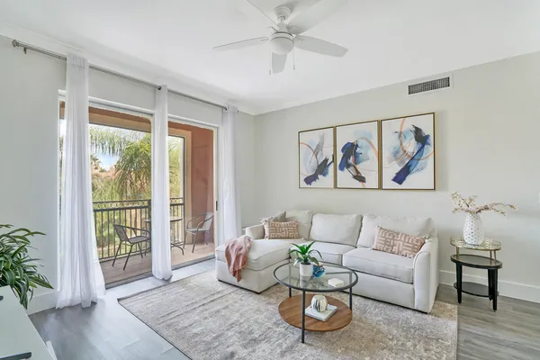 a living room with furniture and a large window