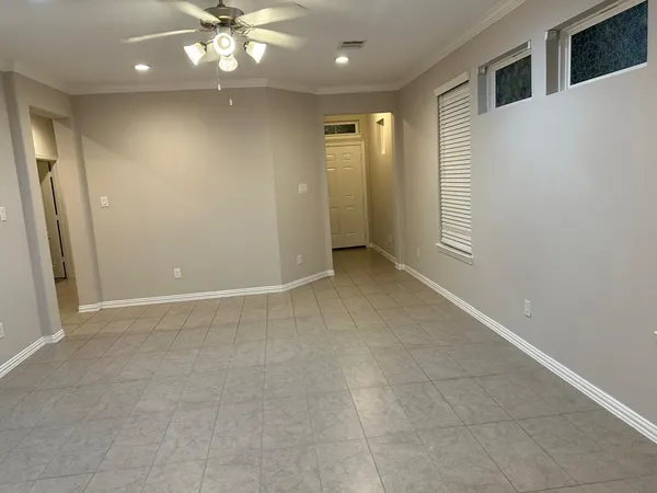 a view of an empty room with a window