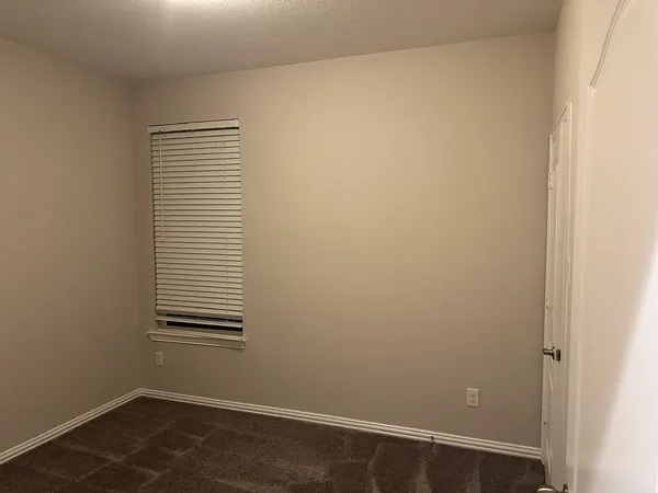a view of a room that has a window in it