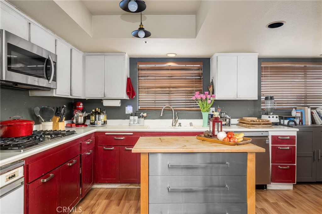 235 Via Ballena San Clemente, CA 92672 - Photo 23 of 51 a kitchen with stainless steel appliances granite countertop a sink stove and microwave