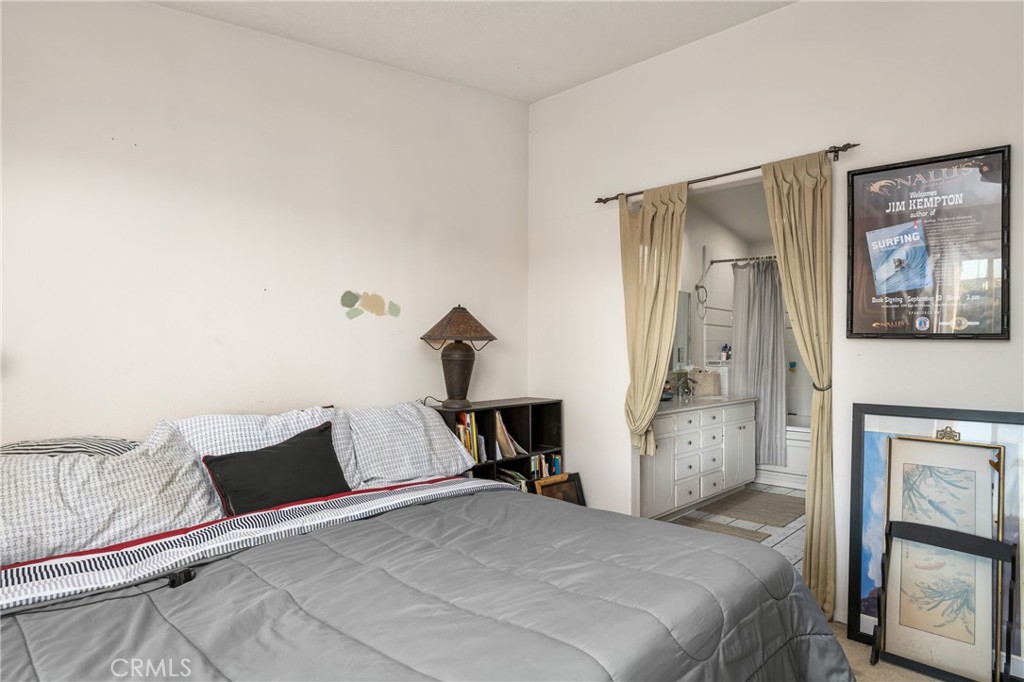 235 Via Ballena San Clemente, CA 92672 - Photo 25 of 51 a bedroom with a bed and wooden floor