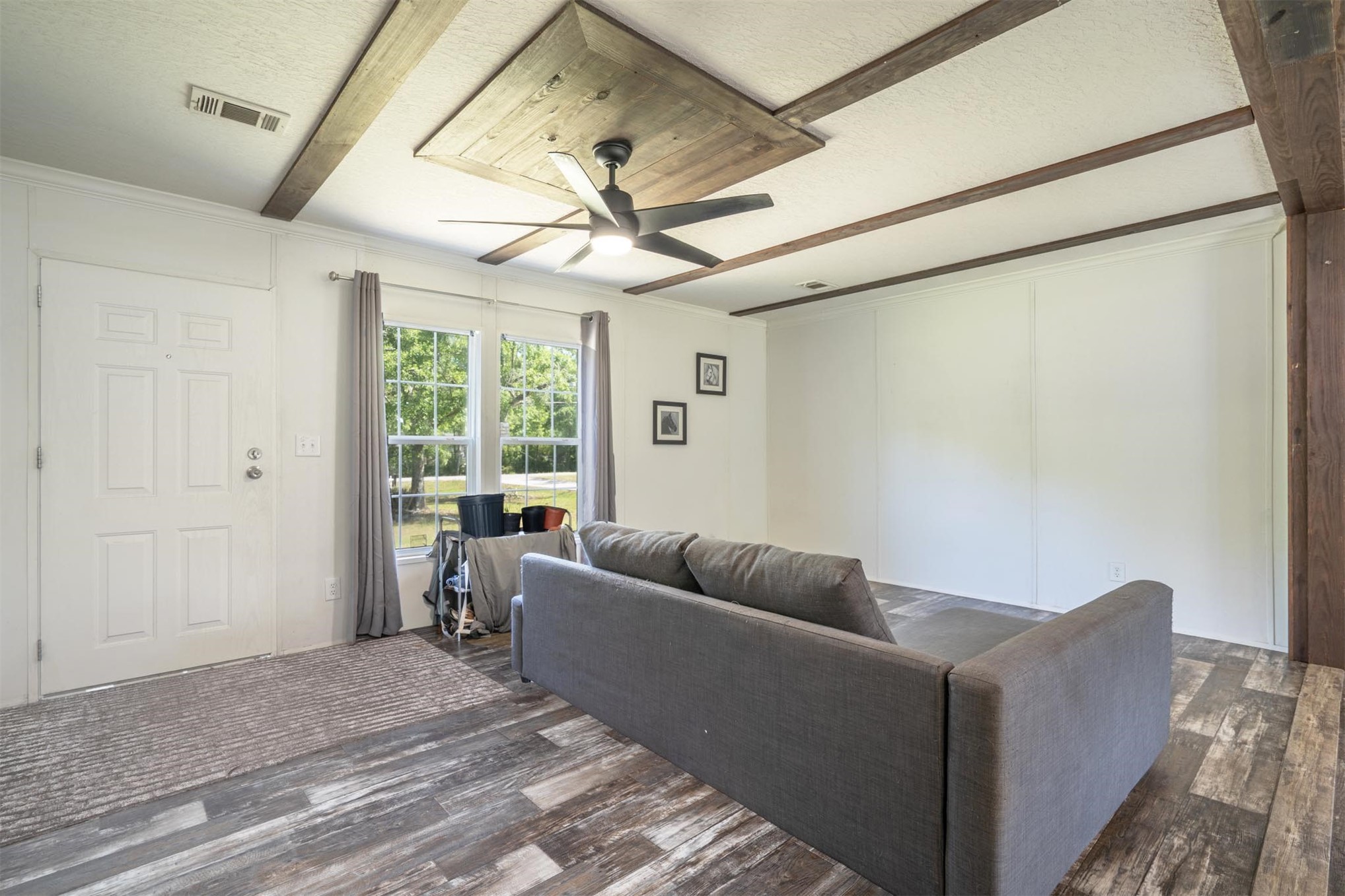 76220 Dove Road Yulee, FL 32097 - Photo 15 of 48 a living room with furniture and a large window