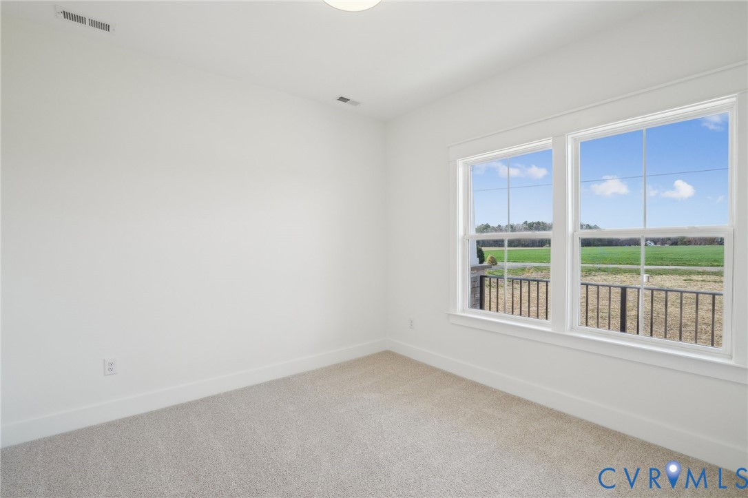 0 Atlee Road Mechanicsville, VA 23116 - Photo 27 of 32 Spare room featuring light colored carpet and base