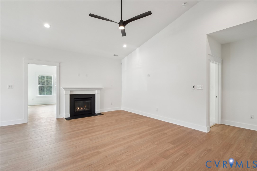 0 Atlee Road Mechanicsville, VA 23116 - Photo 10 of 32 Unfurnished living room with light wood-style floo