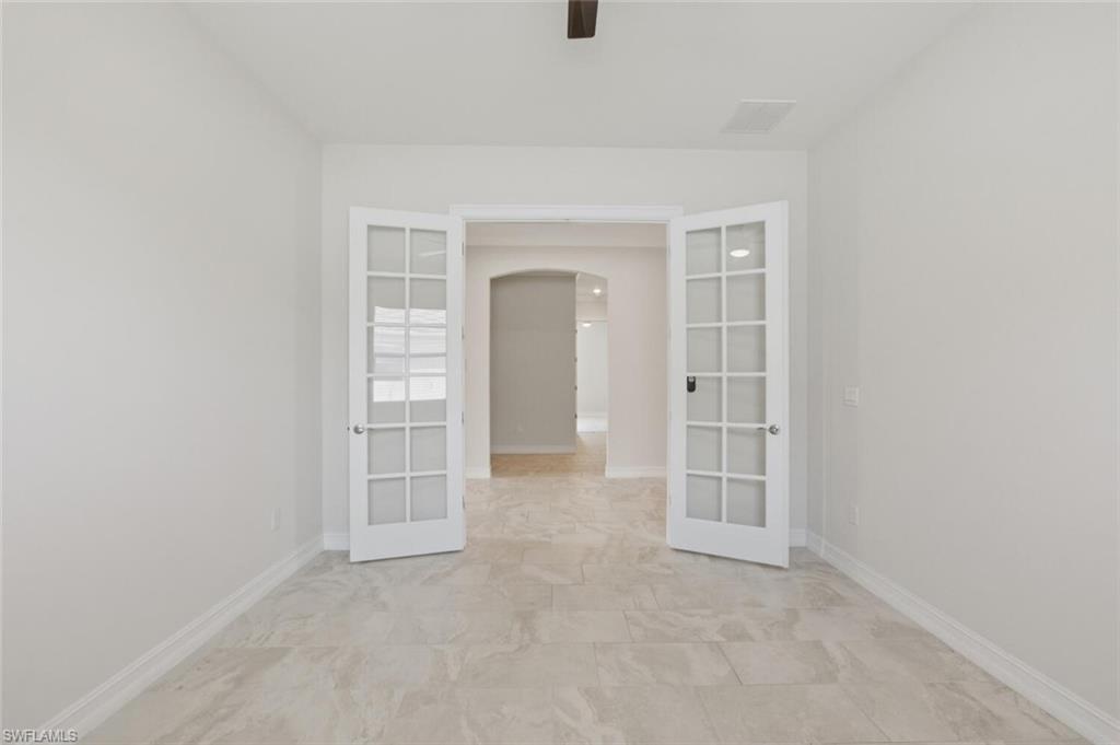 28053 Captiva Shell Loop Bonita Springs, FL 34135 - Photo 13 of 50 an empty room with windows