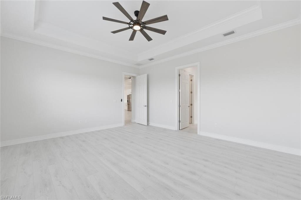 28053 Captiva Shell Loop Bonita Springs, FL 34135 - Photo 17 of 50 an empty room with fan and a ceiling fan