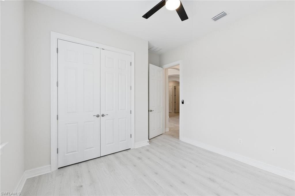 28053 Captiva Shell Loop Bonita Springs, FL 34135 - Photo 21 of 50 an empty room with ceiling fan