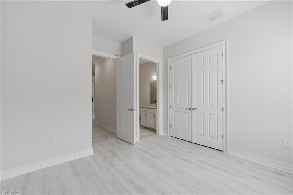 28053 Captiva Shell Loop Bonita Springs, FL 34135 - Photo 24 of 50 wooden floor in an empty room