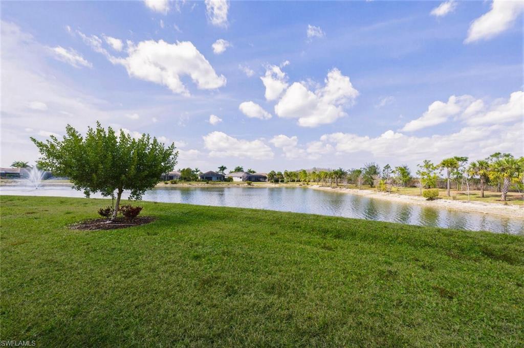 28053 Captiva Shell Loop Bonita Springs, FL 34135 - Photo 27 of 50 a view of lake with houses in the back