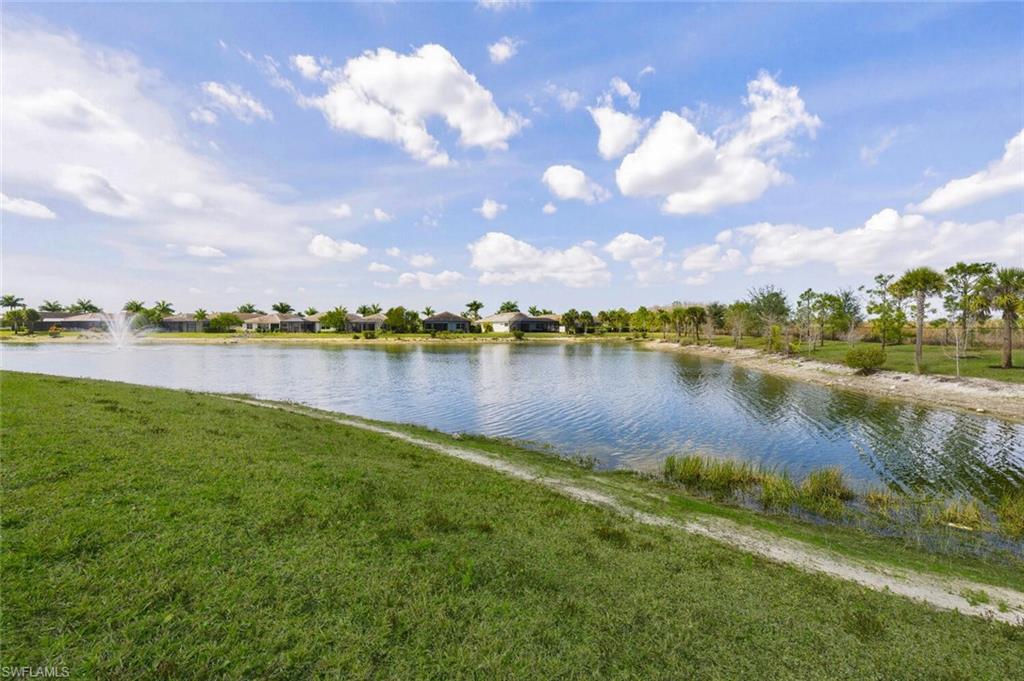 28053 Captiva Shell Loop Bonita Springs, FL 34135 - Photo 29 of 50 a view of a lake with houses in the back