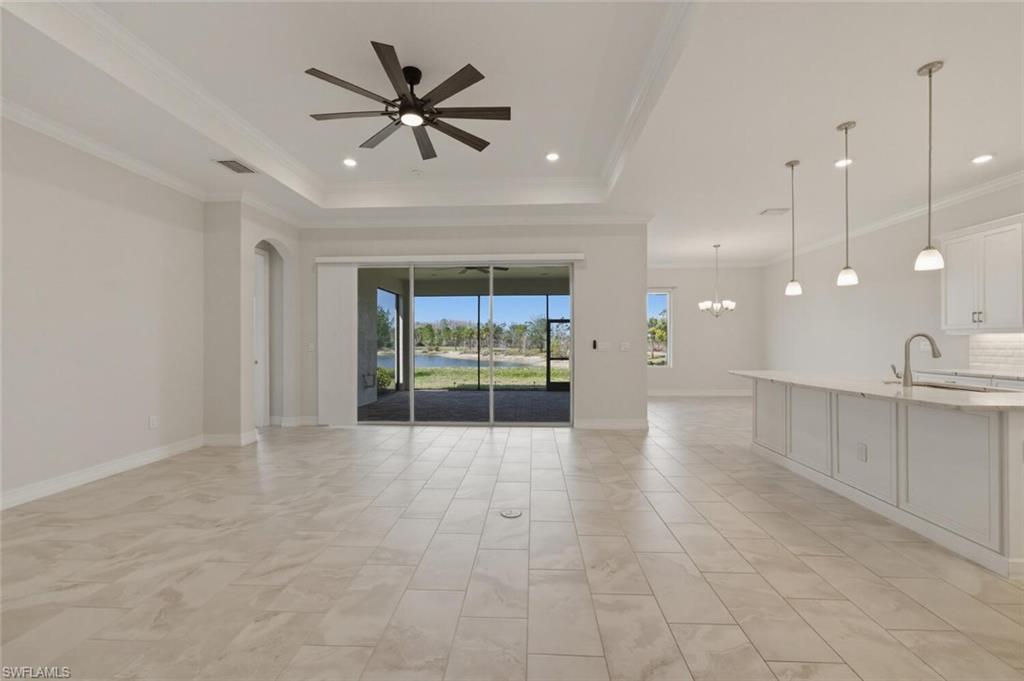 28053 Captiva Shell Loop Bonita Springs, FL 34135 - Photo 3 of 50 a view of an empty room with a kitchen