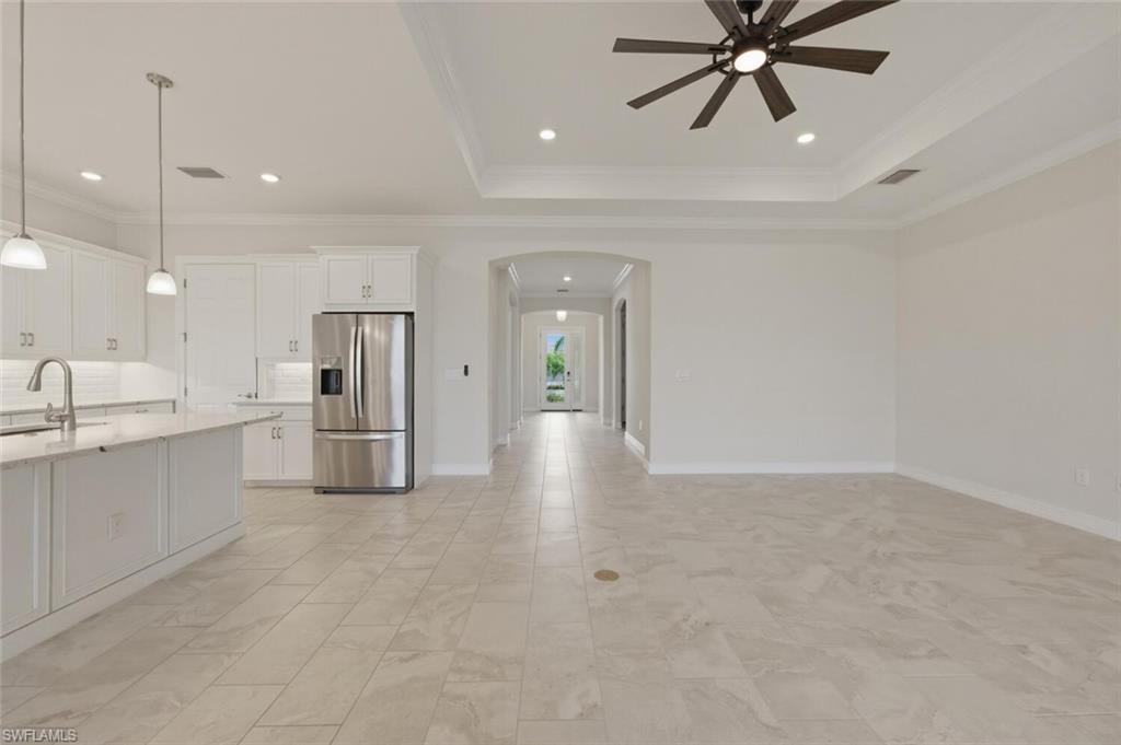 28053 Captiva Shell Loop Bonita Springs, FL 34135 - Photo 5 of 50 a view of a kitchen with a sink and stainless steel appliances