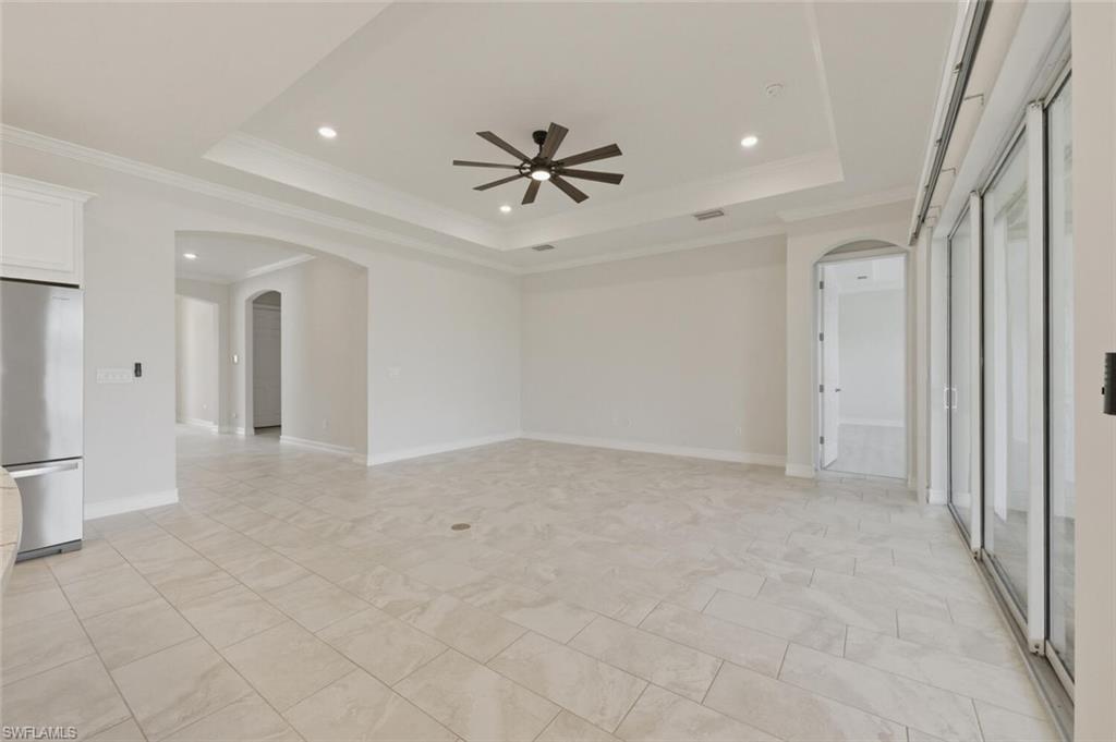 28053 Captiva Shell Loop Bonita Springs, FL 34135 - Photo 6 of 50 a view of a livingroom with a ceiling fan and carpet