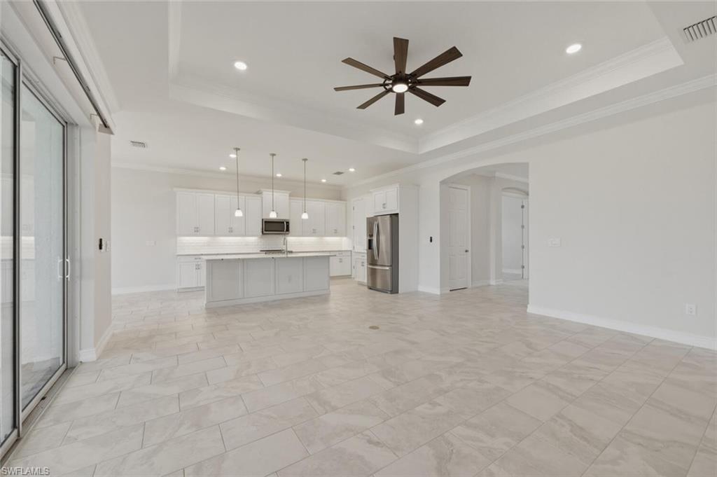 28053 Captiva Shell Loop Bonita Springs, FL 34135 - Photo 7 of 50 a view of a kitchen with a sink and cabinet a projector room