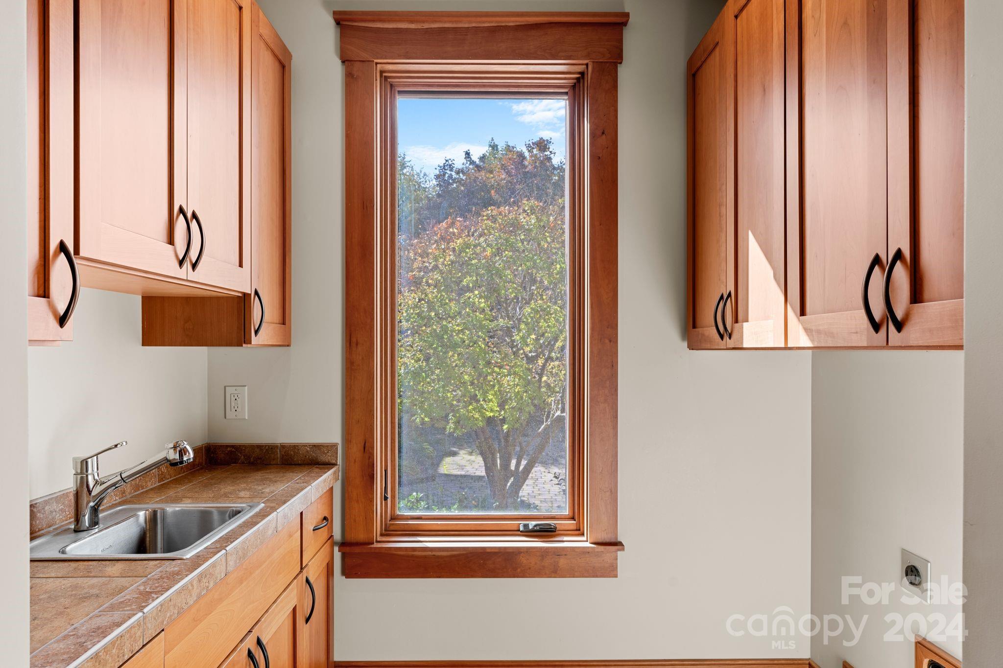 150 Cherry Hill Mill Spring, NC 28756 - Photo 17 of 39 a kitchen with a sink and large window