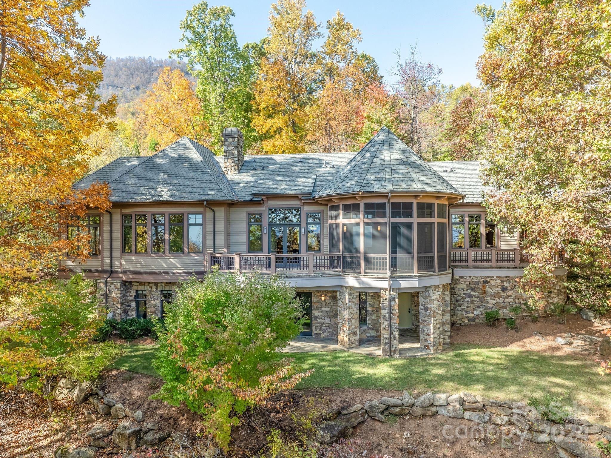 150 Cherry Hill Mill Spring, NC 28756 - Photo 2 of 39 a front view of a house with a yard table and chairs
