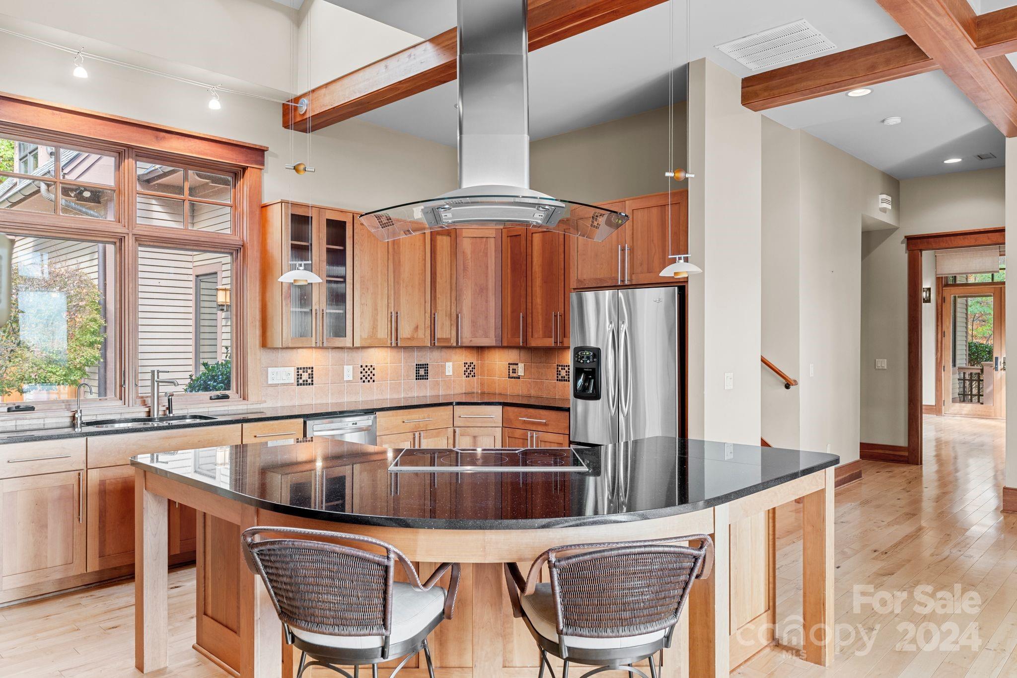 150 Cherry Hill Mill Spring, NC 28756 - Photo 10 of 39 a kitchen with a table chairs and a refrigerator