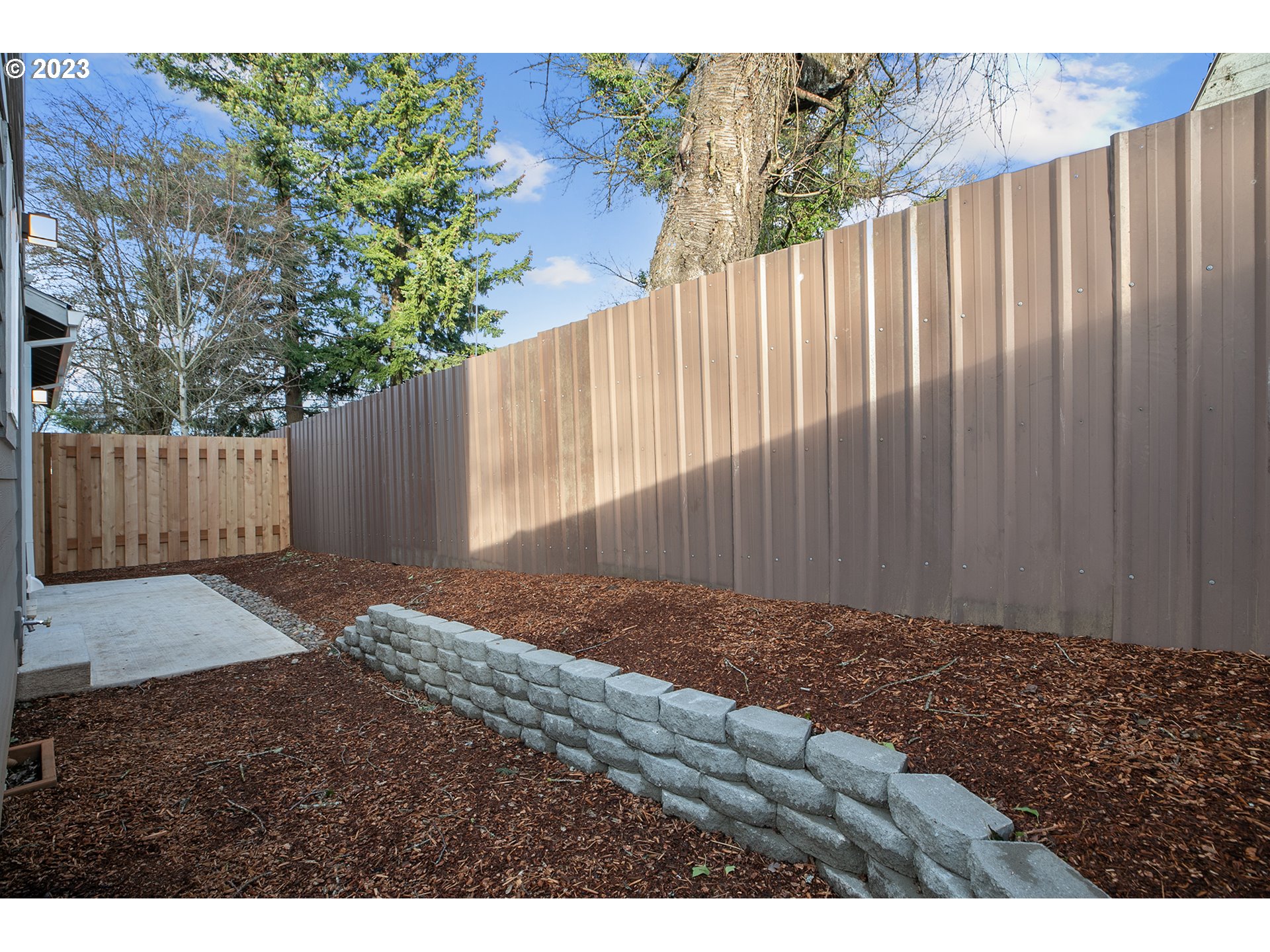 9046 Southeast Clinton Street, Unit B Portland, OR 97266 - Photo 12 of 18 a view of a backyard