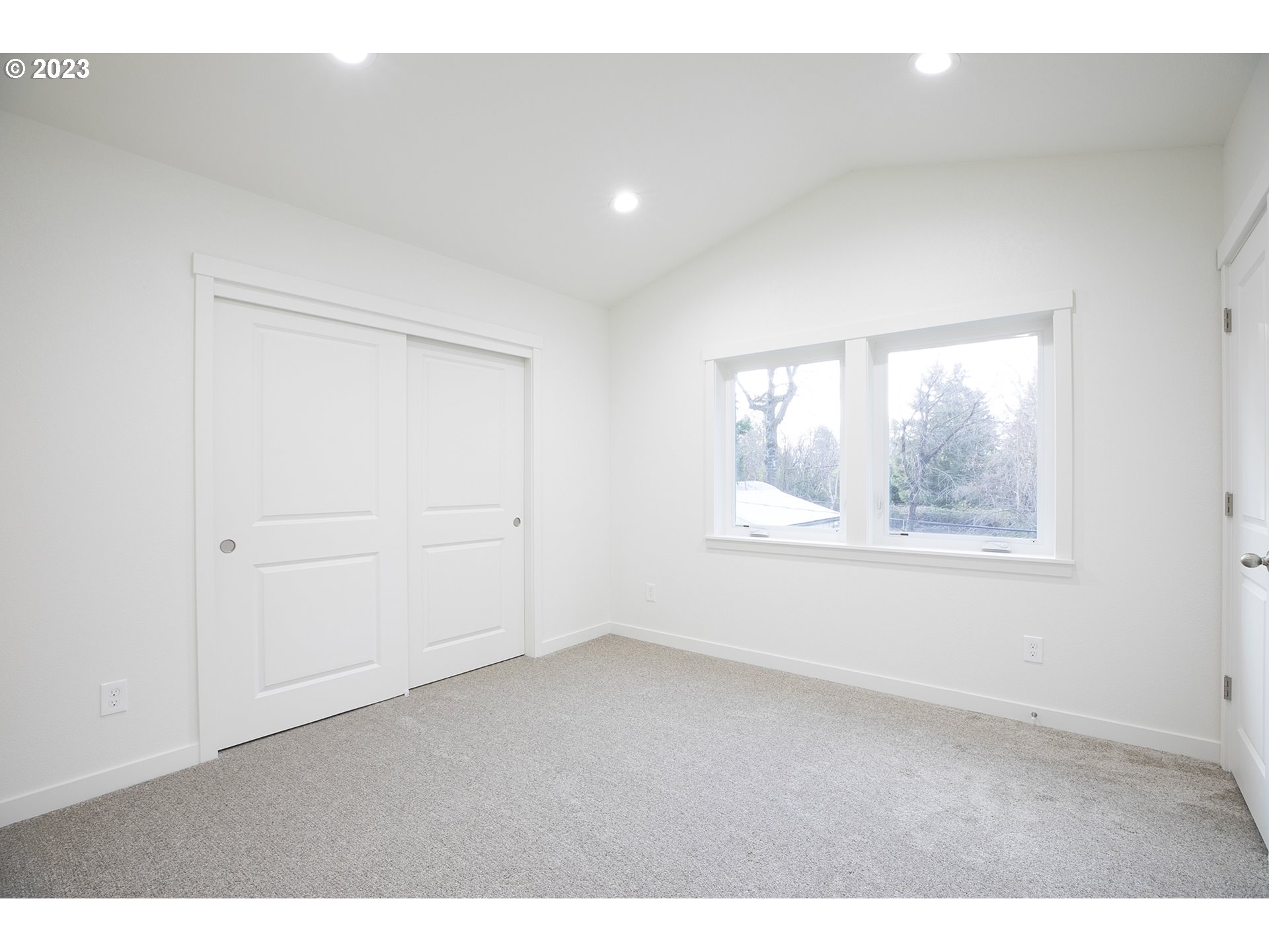9046 Southeast Clinton Street, Unit B Portland, OR 97266 - Photo 17 of 18 a view of an empty room with a window