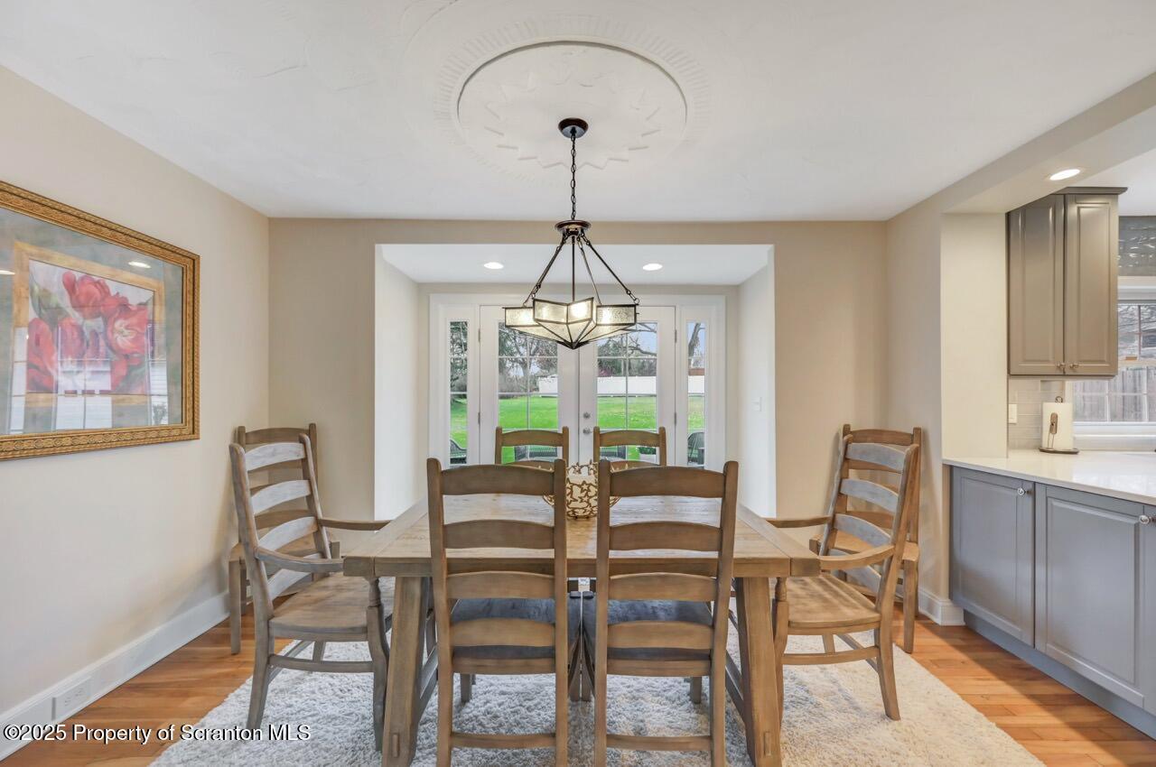 235 North Abington Road Clarks Green, PA 18411 - Photo 19 of 79 a dining room with furniture a chandelier and window