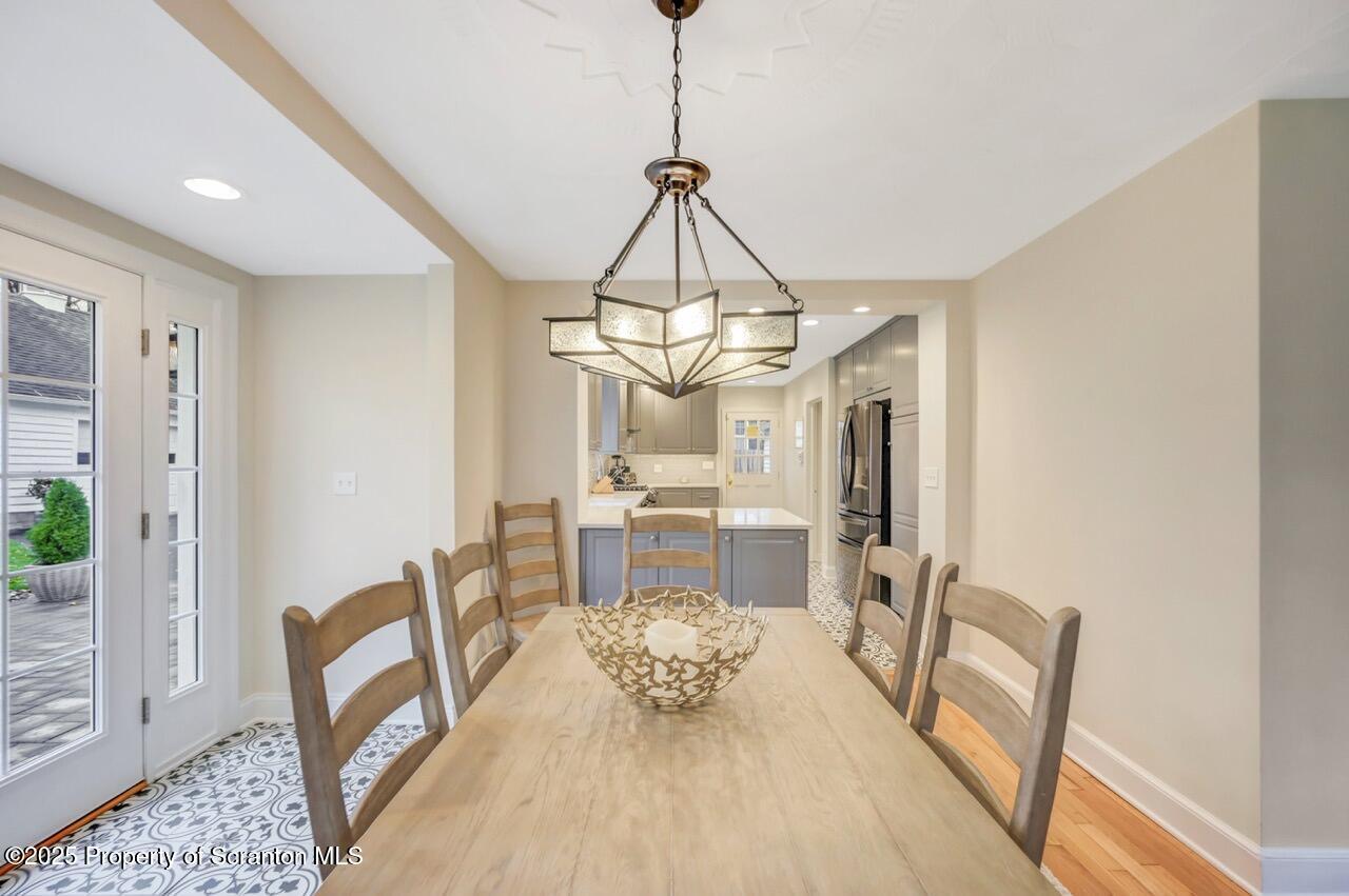 235 North Abington Road Clarks Green, PA 18411 - Photo 21 of 79 a dining room with furniture a chandelier and wooden floor