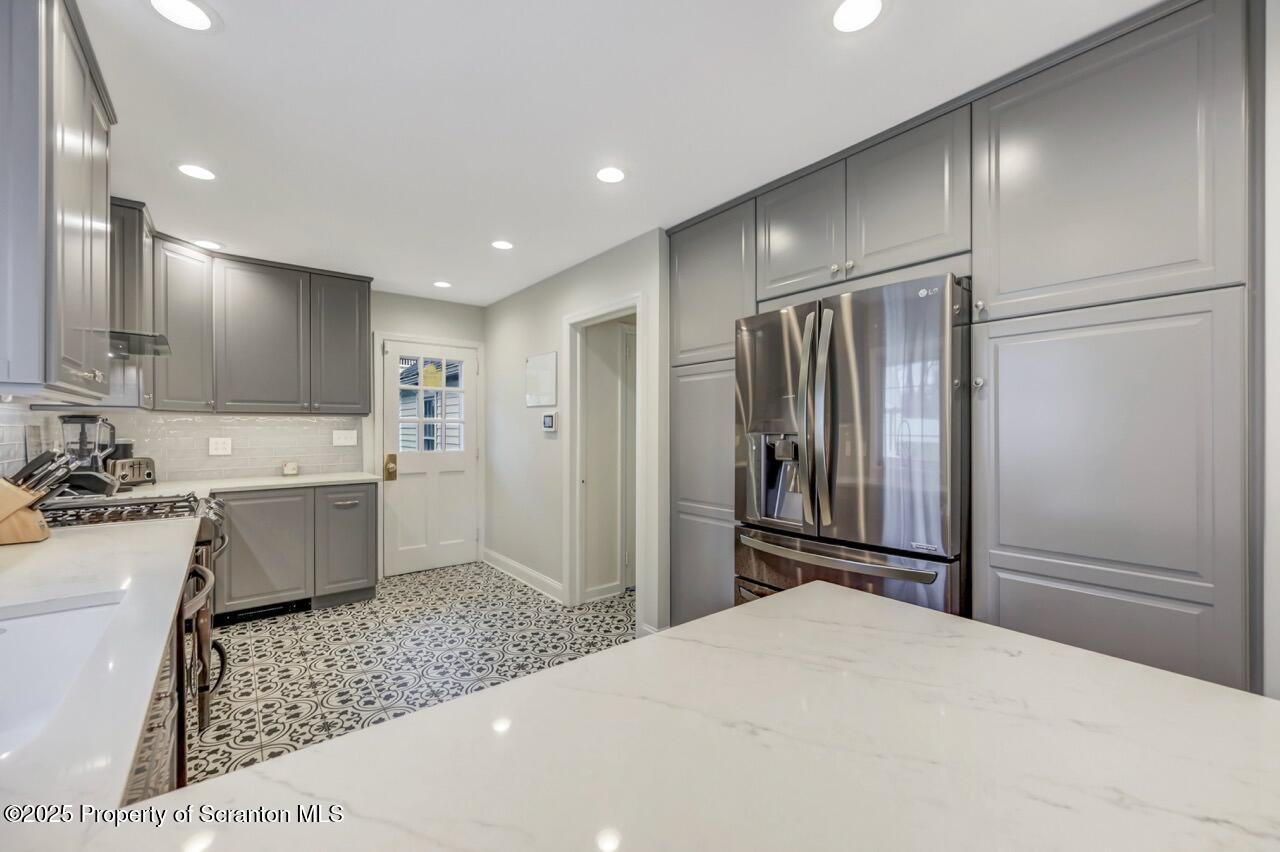 235 North Abington Road Clarks Green, PA 18411 - Photo 26 of 79 a large kitchen with a refrigerator and a sink
