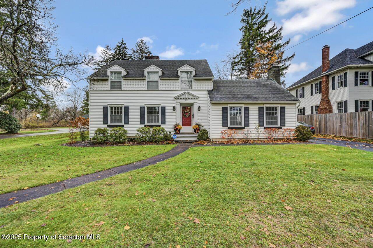 235 North Abington Road Clarks Green, PA 18411 - Photo 3 of 79 a front view of a house with a yard table and chairs