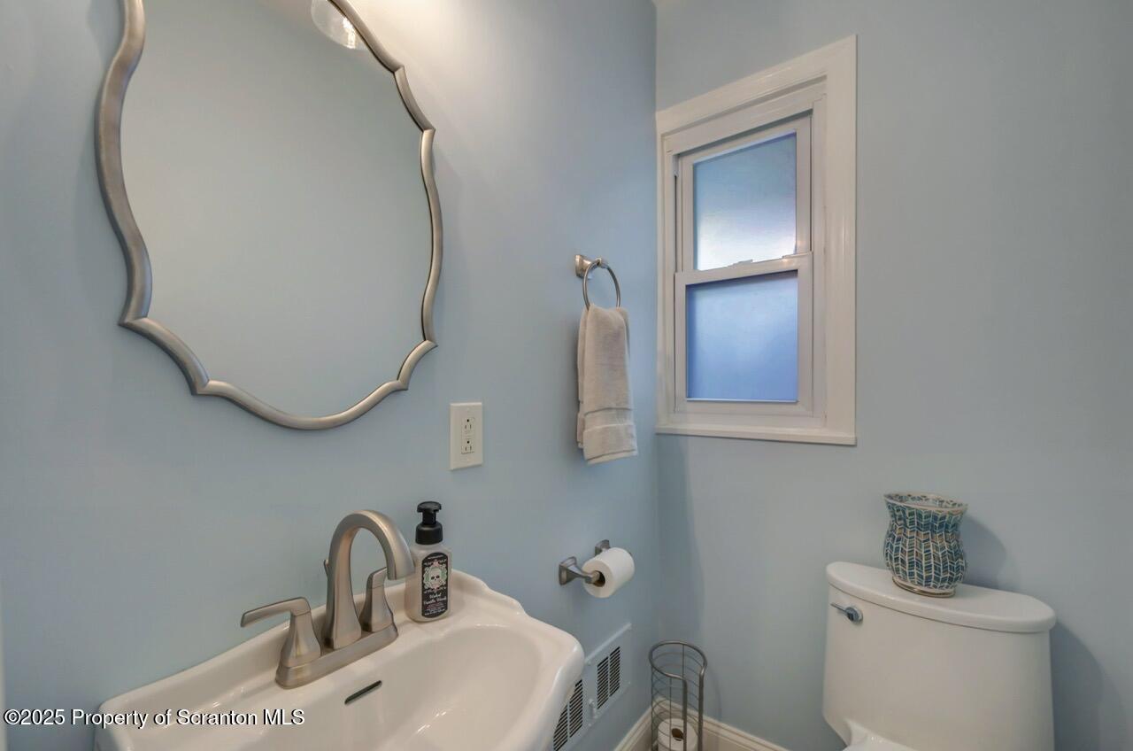 235 North Abington Road Clarks Green, PA 18411 - Photo 38 of 79 a bathroom with a sink and mirror with toilet