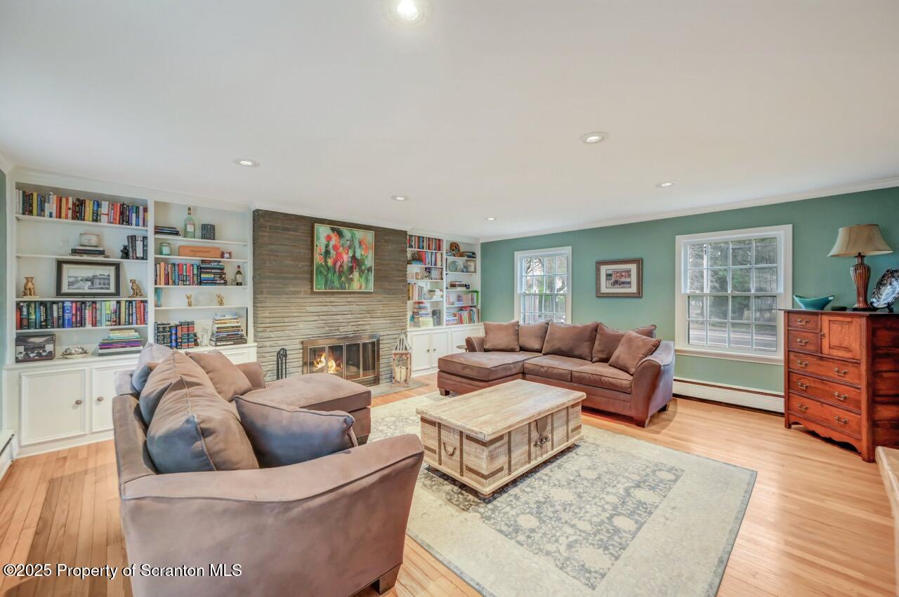 235 North Abington Road Clarks Green, PA 18411 - Photo 43 of 79 a living room with furniture and a book shelf