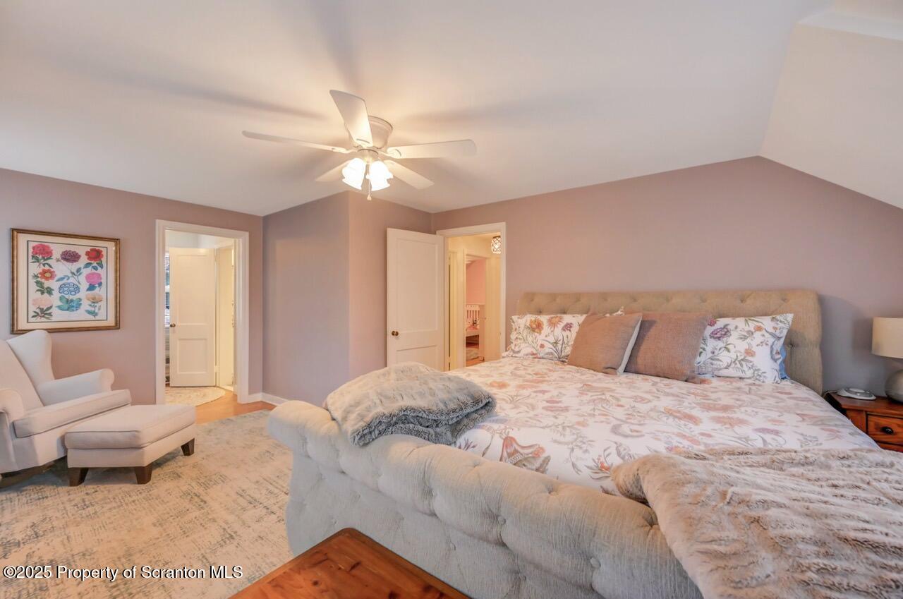 235 North Abington Road Clarks Green, PA 18411 - Photo 52 of 79 a bedroom with a bed and a chandelier