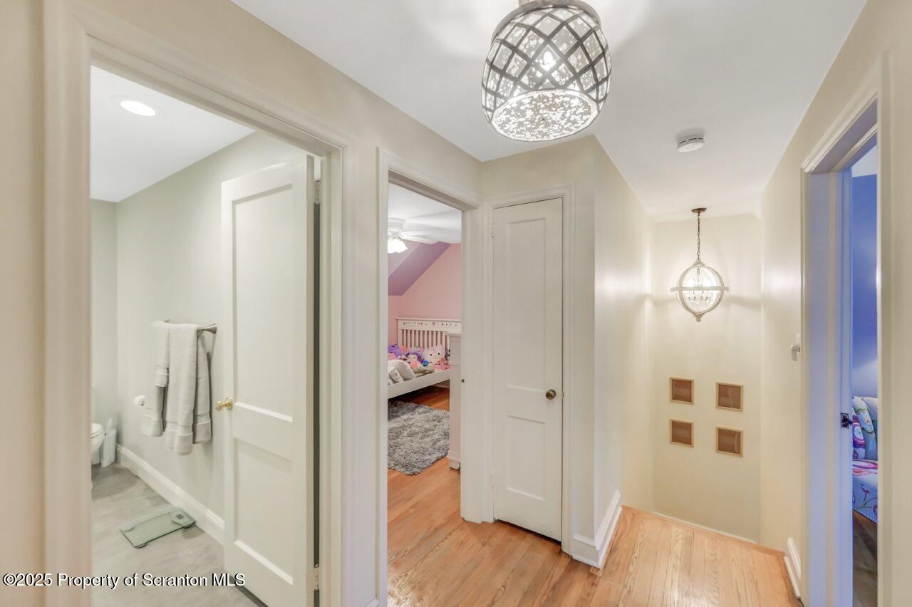 235 North Abington Road Clarks Green, PA 18411 - Photo 57 of 79 a view of a hallway with entryway dining room and wooden floor