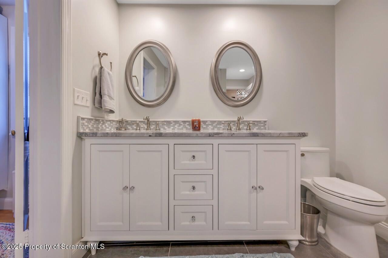 235 North Abington Road Clarks Green, PA 18411 - Photo 60 of 79 a bathroom with 2 sink and a mirror