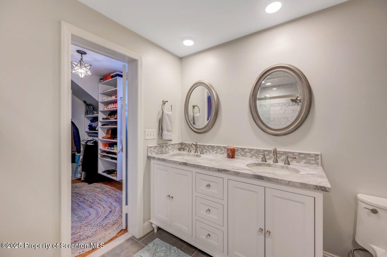 235 North Abington Road Clarks Green, PA 18411 - Photo 61 of 79 a bathroom with a double vanity sink and a mirror